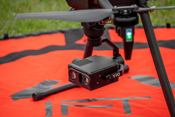 Drone with a camera on an orange surface
