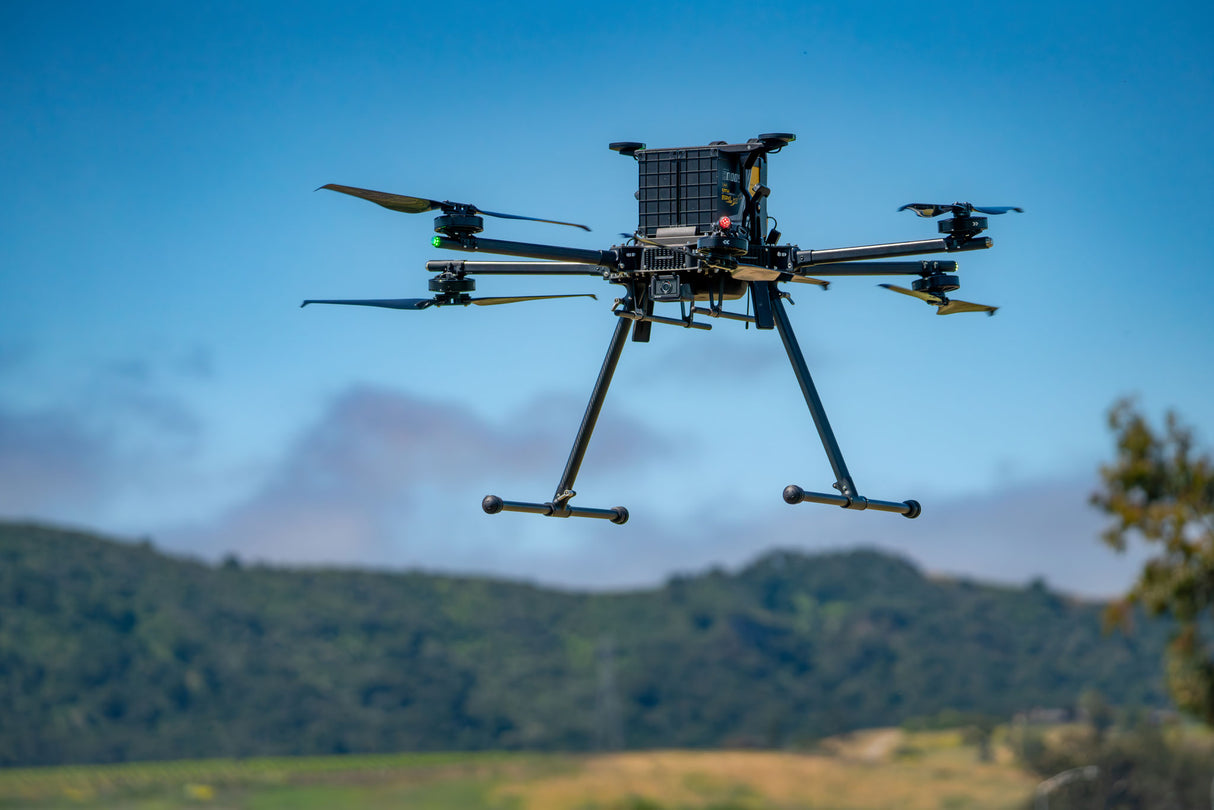 Drone flying with dual battery system and allowance for payload drop to rescue