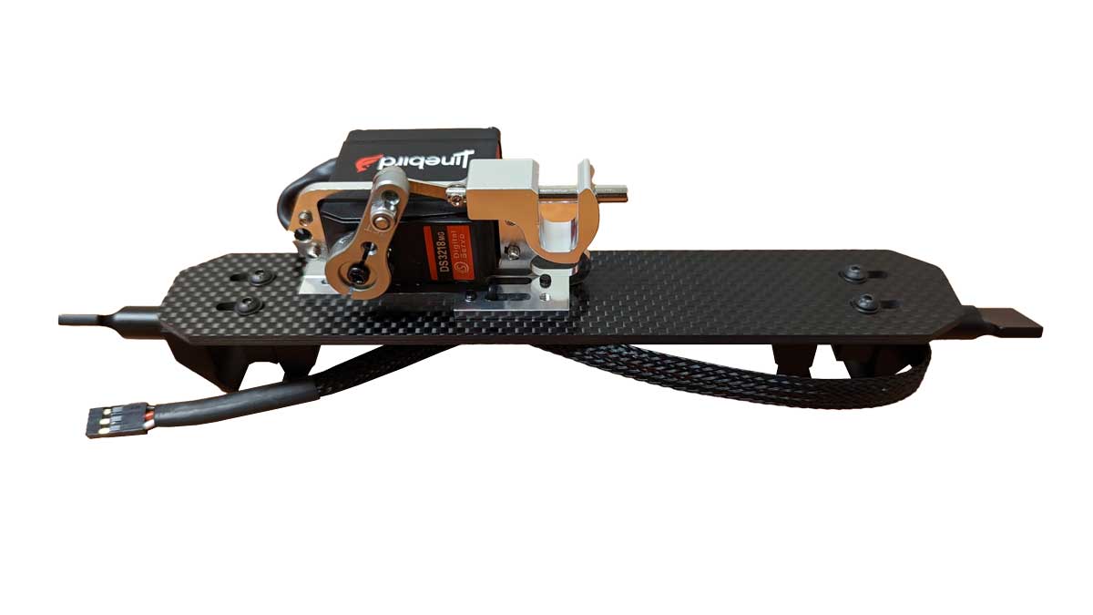 A carbon fiber RC car chassis with a mounted brushless motor, featuring a black body, copper-colored motor components, and a black cable, shown against a plain white background.