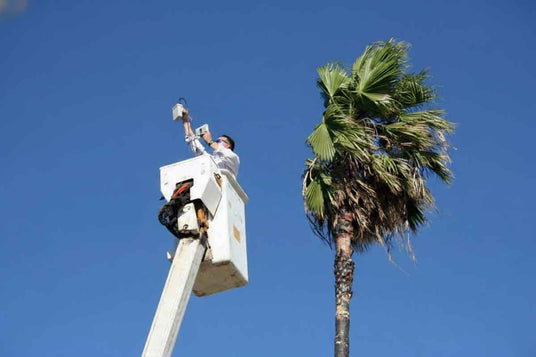 Person in a bucket truck testing wireless video equipment