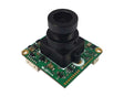 A square green electronic circuit board featuring a prominent black cylindrical camera lens module mounted on top, with gold-plated connectors and components on a white background.