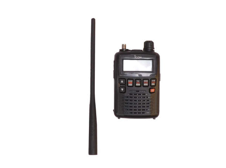 A black handheld body wire receiver with a small screen and multiple buttons, shown next to a long black whip antenna on a plain white background.