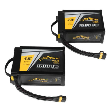 Two black drone flight batteries with connection cables and carrying handles on white background