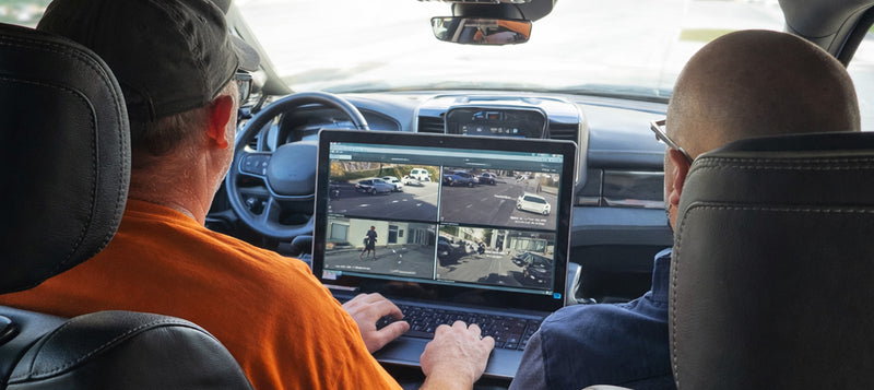 covert agents conducting surveillance from vehicle
