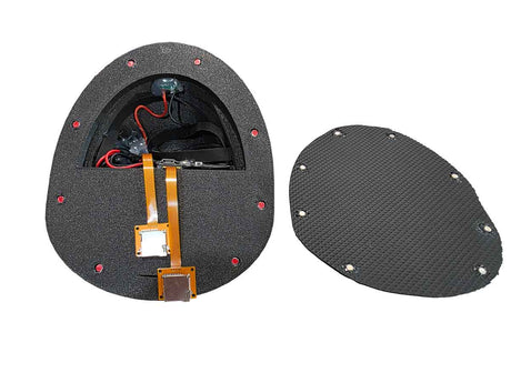 Split view of a carbon fiber component with electronic parts on a white background