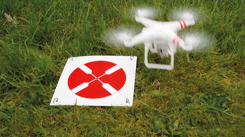 Rothbucher drone ground control target deployed beside a mapping drone