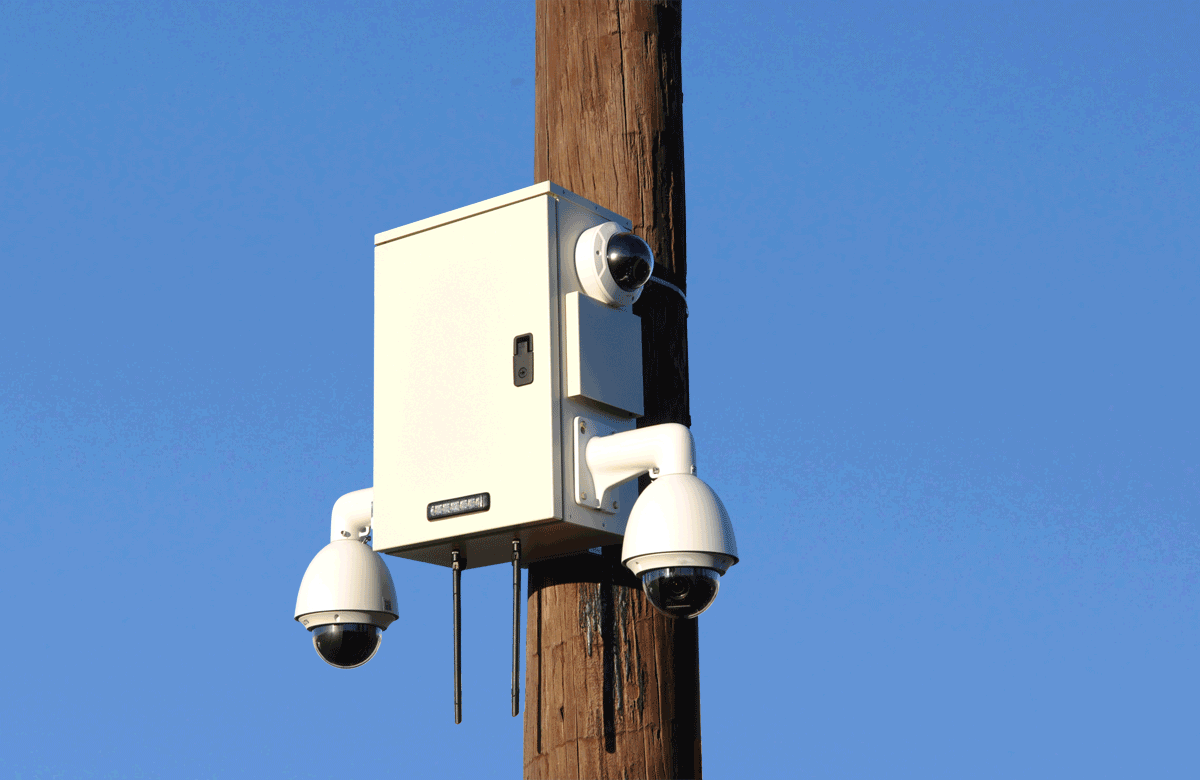 MAXSUR Merlin Smart City Pole Camera with Dual PTZ and and Dual Fixed Dome Camera mounted to utility pole 