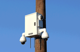 MAXSUR Merlin Smart City Pole Camera with Dual PTZ and and Dual Fixed Dome Camera mounted to utility pole 